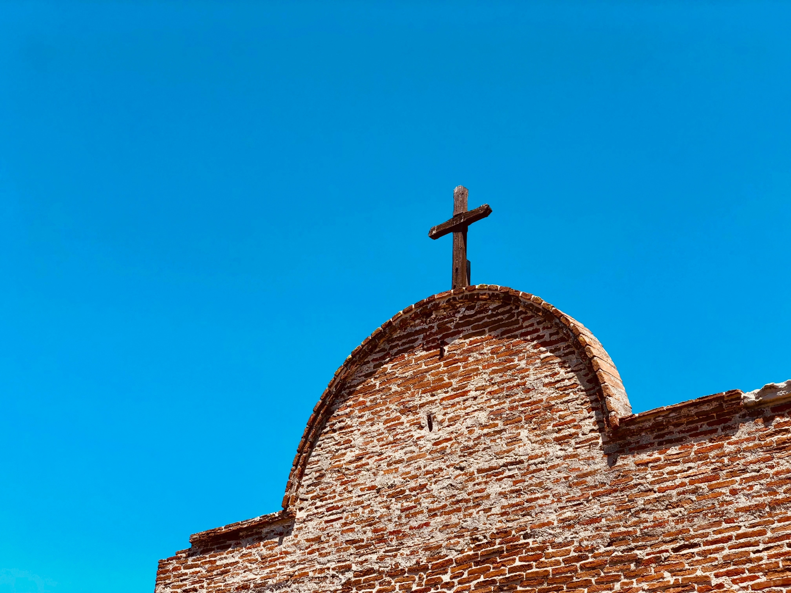 brown cross on chapel